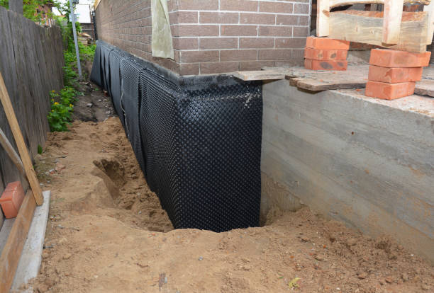 SJ Waterproofing Pros technician performing targeted Emergency Waterproofing assessment in Walton, IN